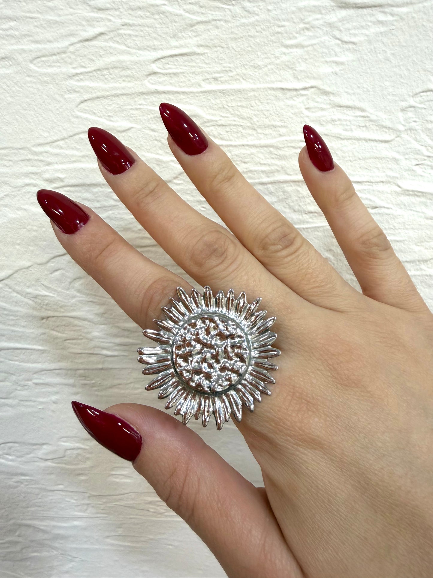 Anillo flor plateado